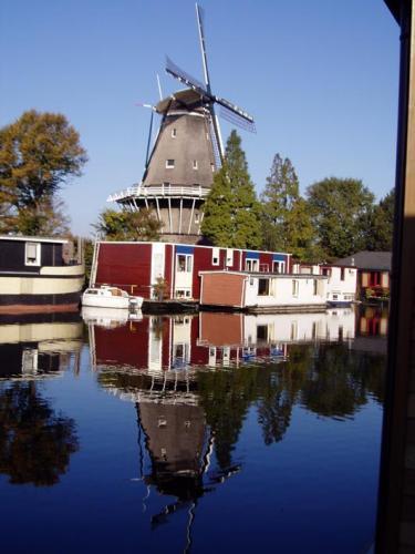 Houseboat Under The Mill Amsterdam